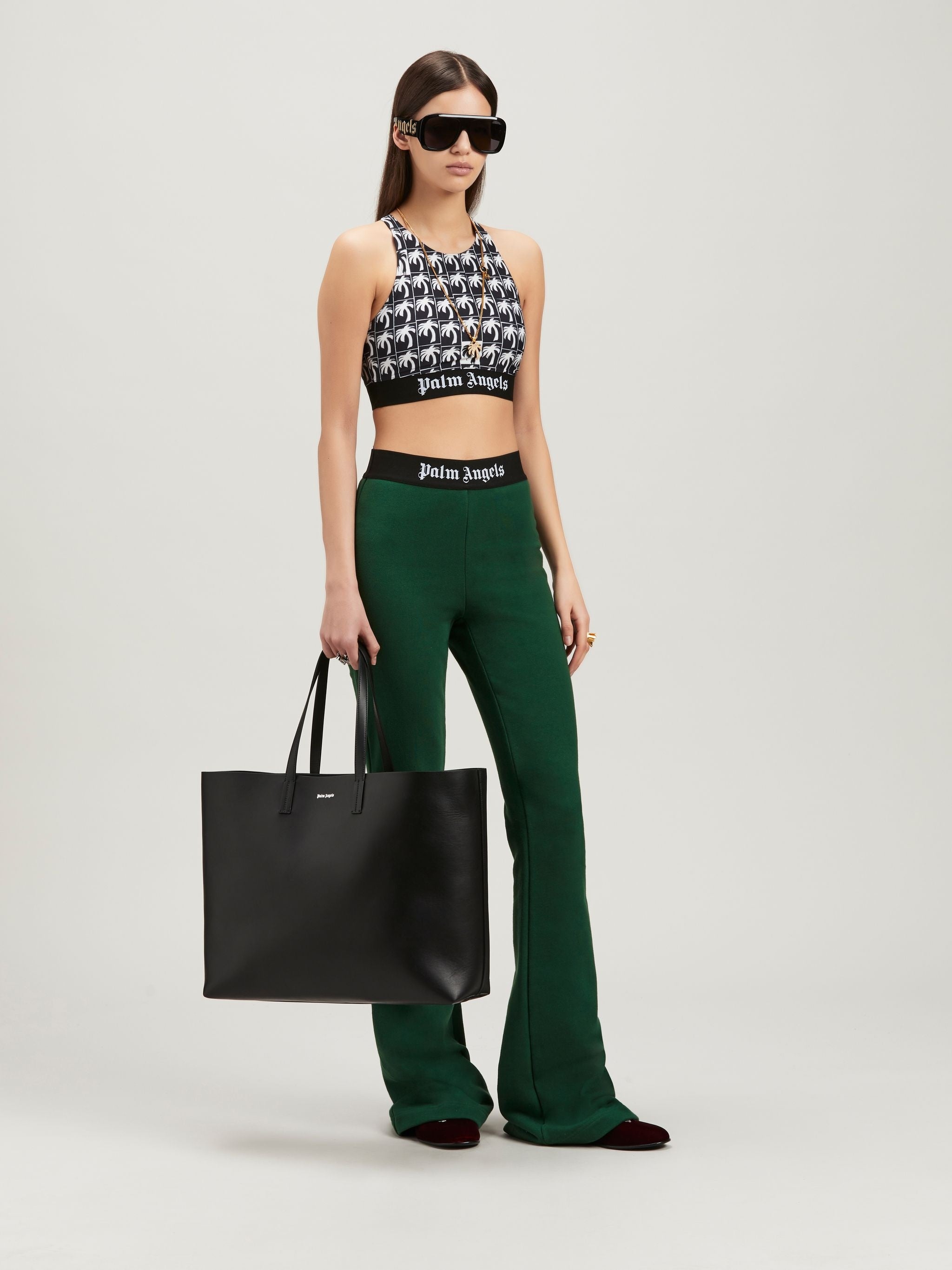 PALM ANGELS LOGO TAPE FLARE SWEATPANTS - BEYMEN